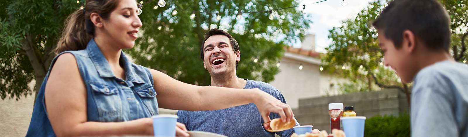 Family enjoy a meal outside