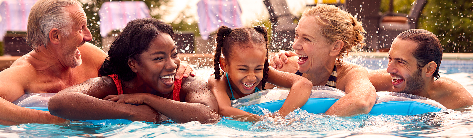 Happy family swimming together